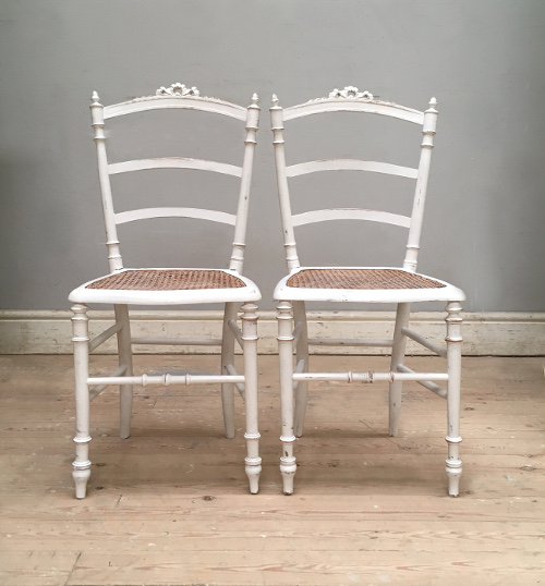 pair of painted cane chairs
